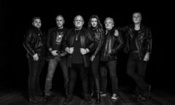 Photo Credit: Eddi Bachmann L-R: Sven Dirkschneider (drums, backing vocals), Mathias “Don” Dieth (guitars, backing vocals), Udo Dirkschneider (lead vocals), Manuela “Ella” Bibert (lead & backing vocals, key instruments), Stefan Kaufmann (guitars, backing vocals), Peter Baltes (bass, lead & backing vocals)